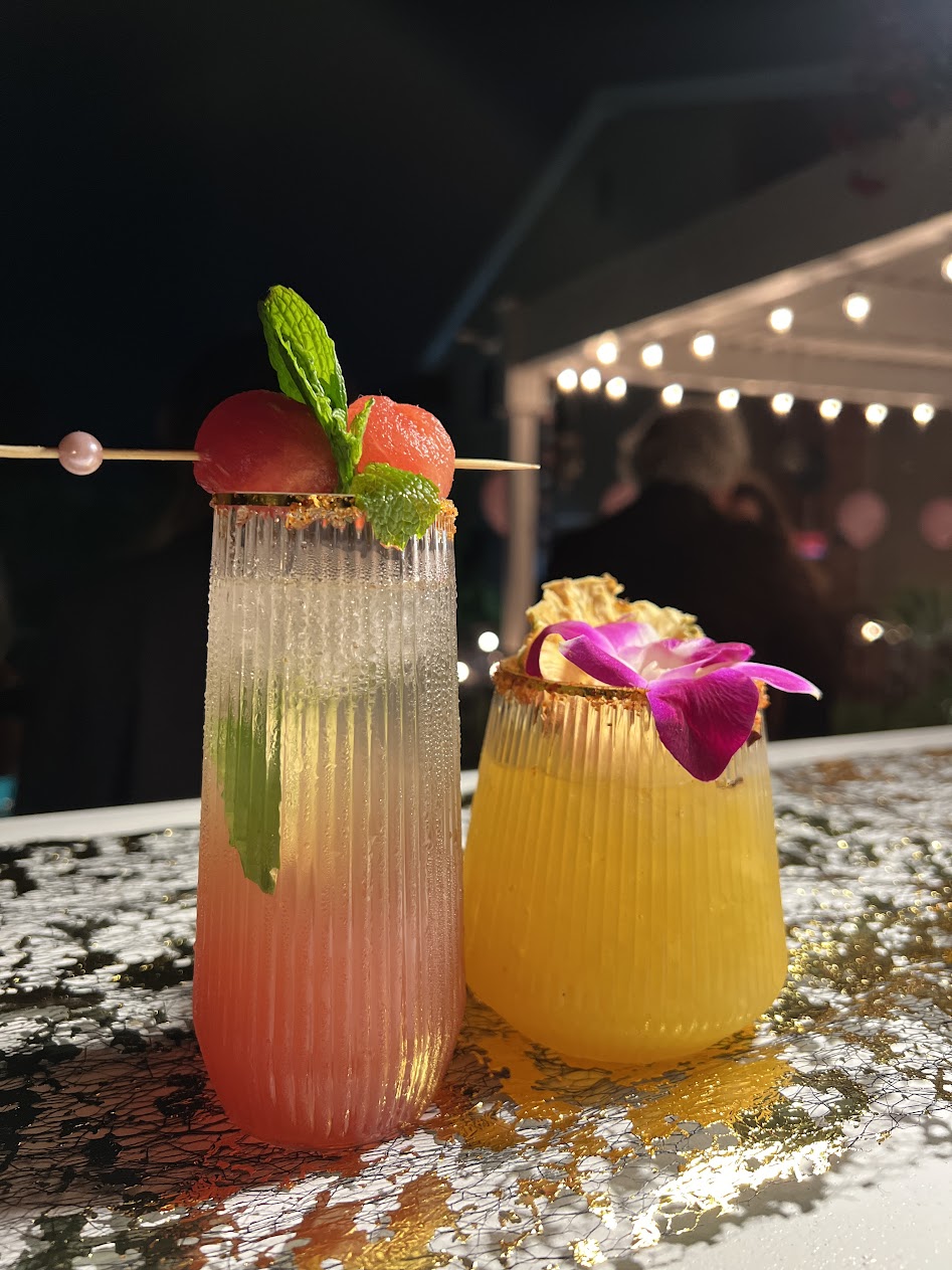 Tropical drinks with fresh garnishes