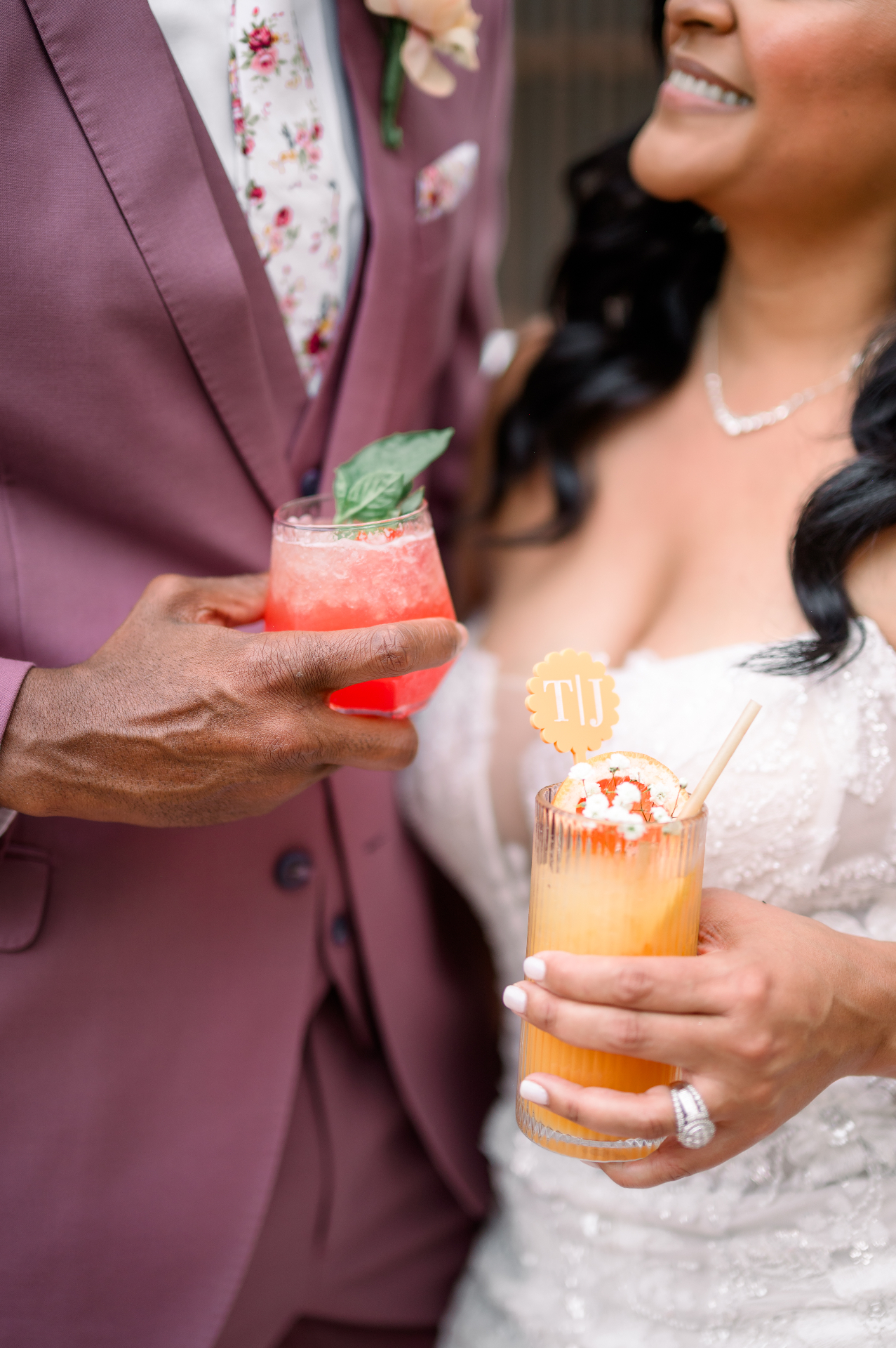 Styled mocktail bar with fresh cherries, glassware, and floral accents