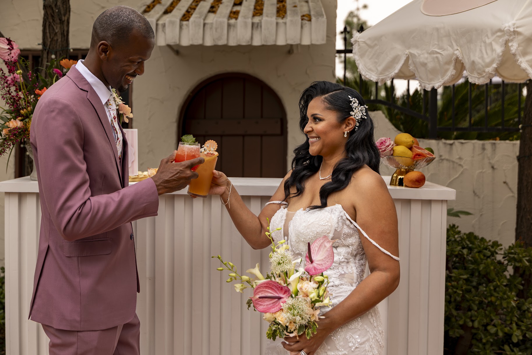 Wedding couple toasting custom mocktails at a Fizz and Flirt mobile bar
