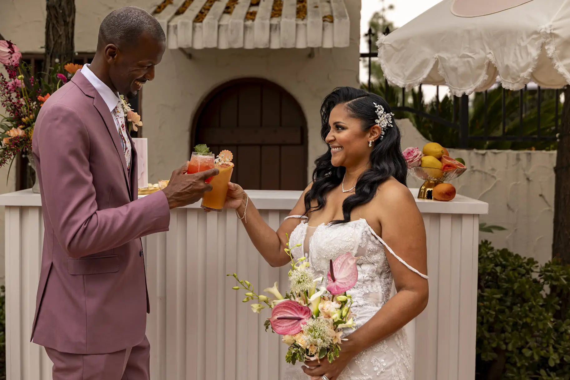 Wedding couple toasting custom mocktails at a Fizz and Flirt mobile bar