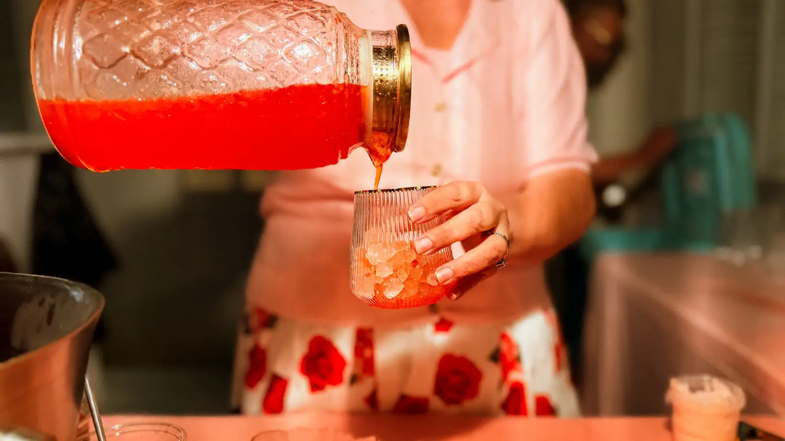 Bartender crafting a herb-infused mocktail for guests