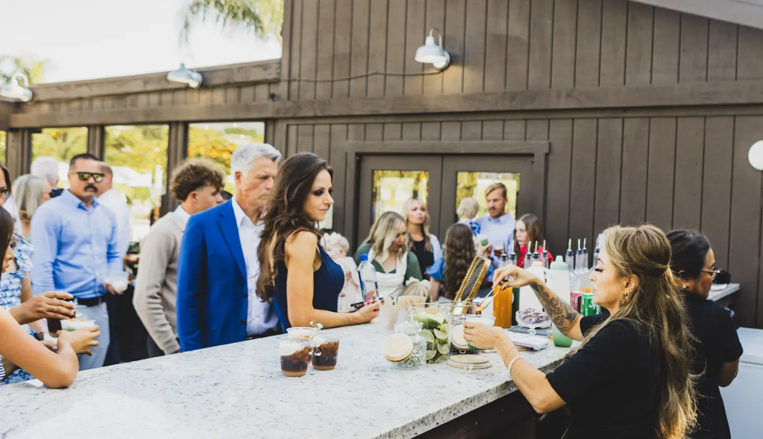 Fizz and Flirt mobile soda bar serving craft dirty sodas to wedding guests at The Grove Redlands outdoor reception